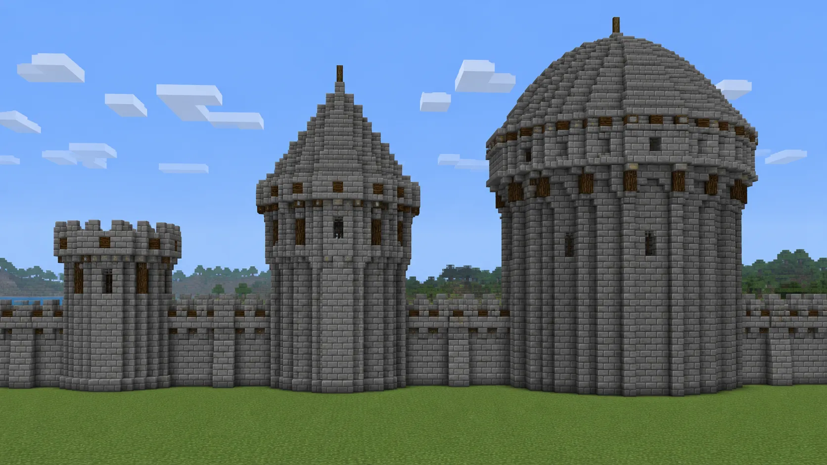 Three Minecraft round towers at diameters 9, 13, and 21 along the same castle wall for use-case comparison