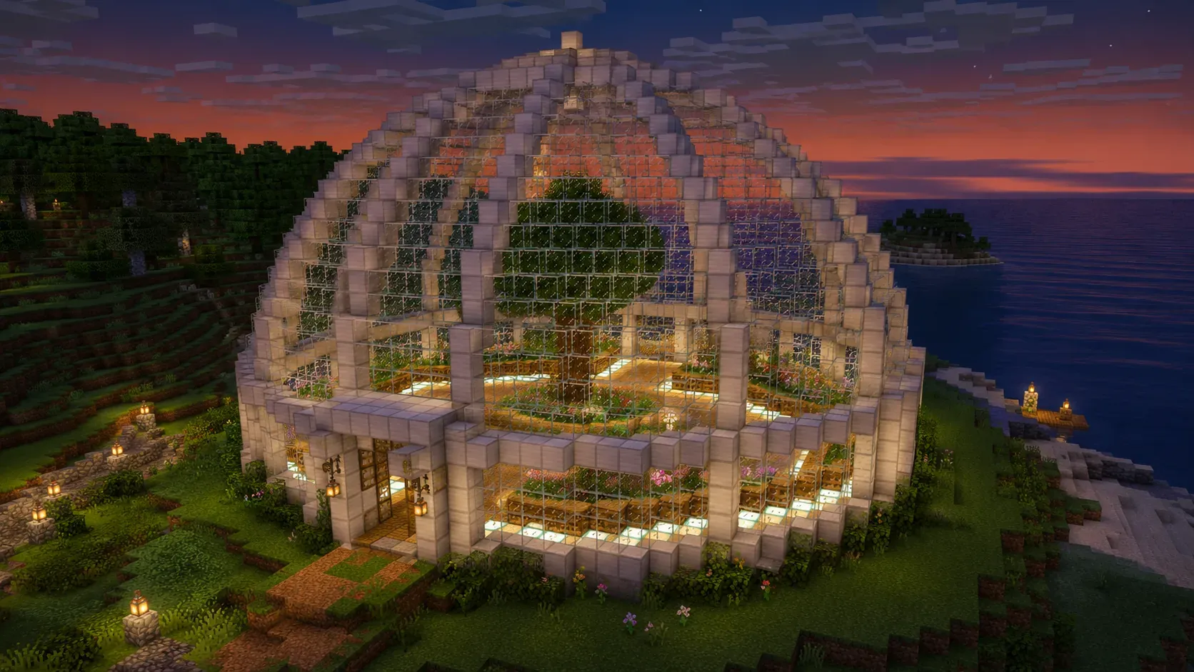 A finished Minecraft glass dome greenhouse lit from inside
