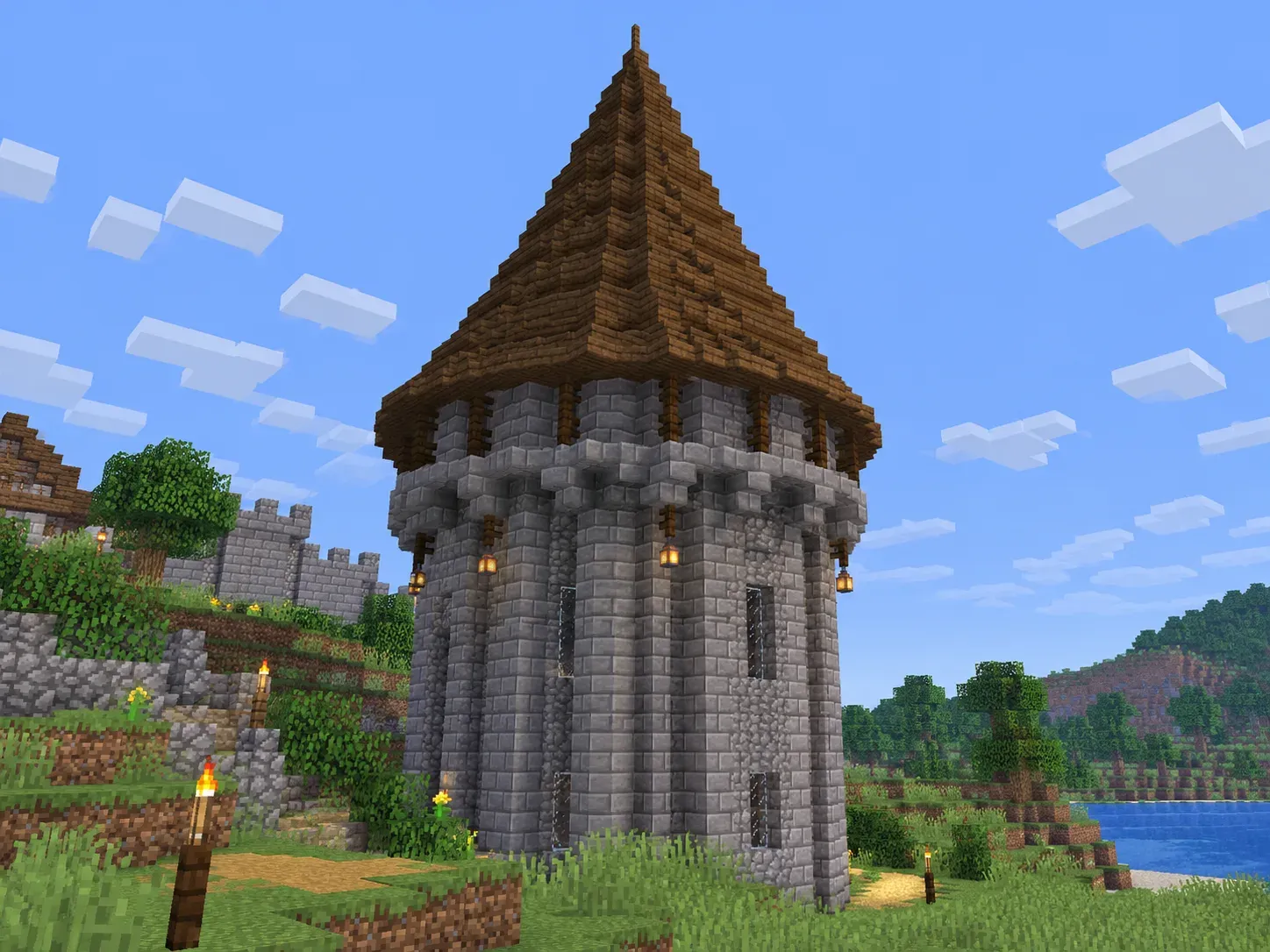Minecraft round tower with a conical tapered roof built from shrinking circle rings